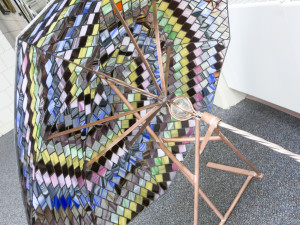 PHOTO BY LAUREN KASTNER Hammitt’s mosaic umbrella is currently on display at the Coon Rapids Campus Library. This piece is part of a larger work Hammitt is currently working  on.